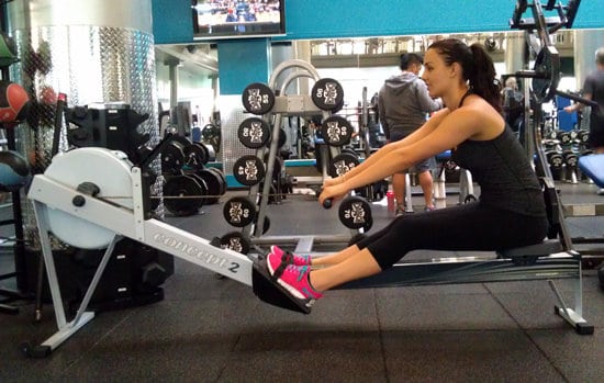 lady at the gym on a concept2 rower exercising