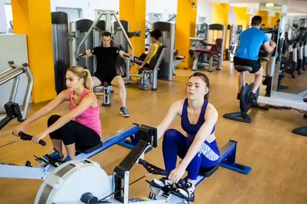 ladies learning simple rowing workouts classes