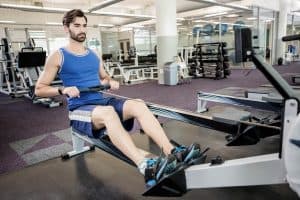 man using a rowing machine