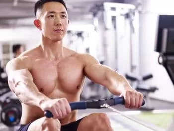 man showing what a rowing machine targets which muscles
