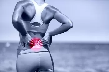 person stretching to prevent rowing back pain