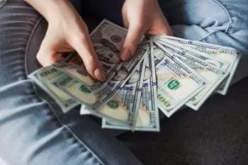 hand holding money saved