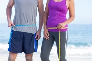 man and woman on beach after 20 minutes of rowing