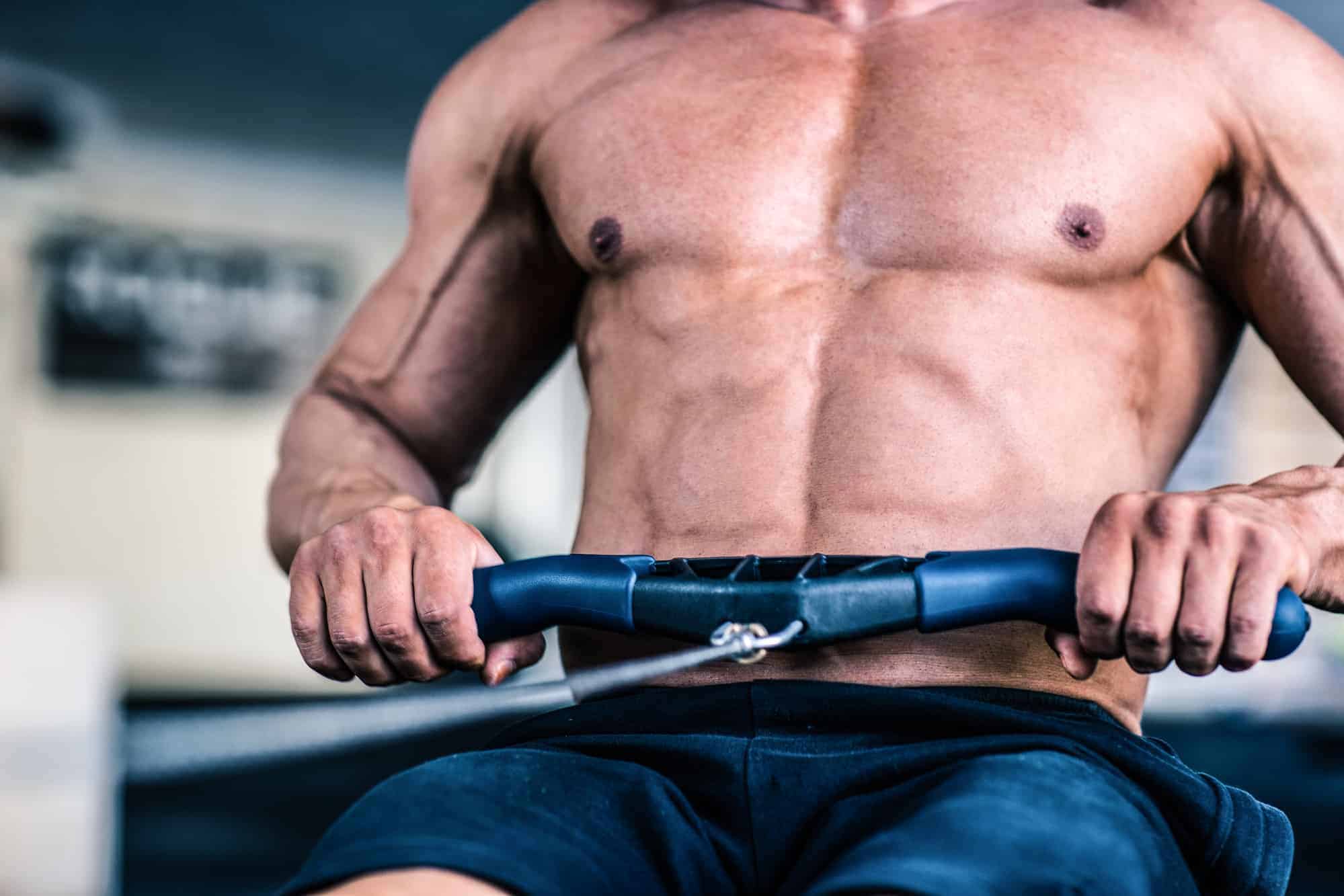 man showing the difference between indoor rowing vs indoor cycling