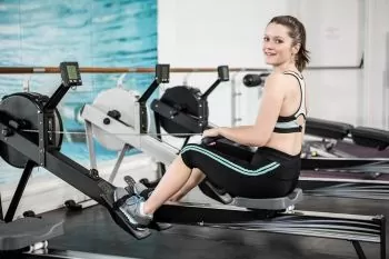 girl trying 30 min rowing machine workout