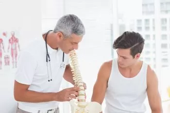 doctor explaining to patient about disc issues and exercise