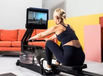 Back view of a woman working out on a CityRow Go water rower