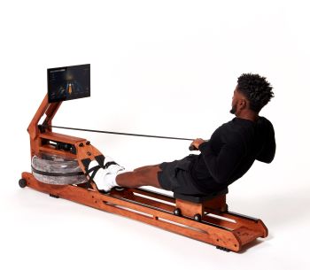 man rowing on wooden rowing machine