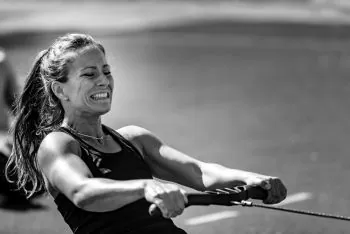 lady on a rowing machine with neck pain