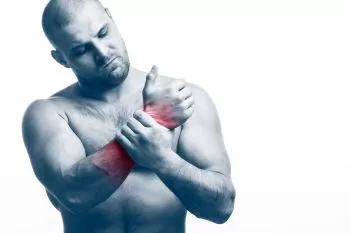 man suffering from rowing machine wrist injury