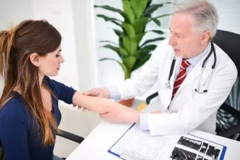 woman consulting about her elbow pain