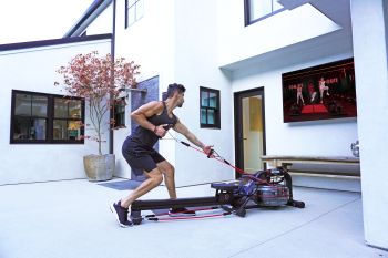 a man using the LIT strength machine with Resistance Bands in his workout