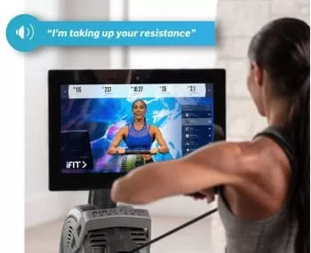 woman using iFit app for her rowing workout