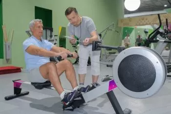old man training at the gym
