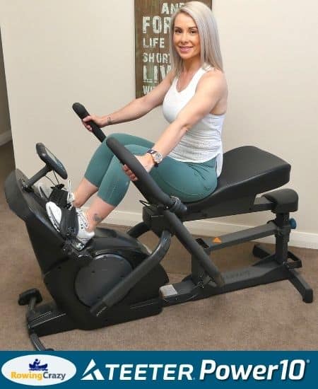 Personal trainer Zoe exercising on the Teeter Power10 Elliptical Rower