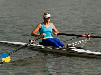 lady showing on water rowing technique 