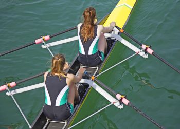 two women rowing together