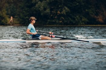 man rowing training on river