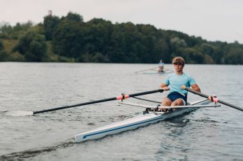 man showing rowing tips on water