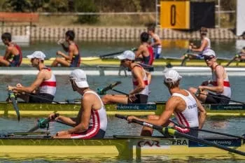 teams of rower with their rowing coaches