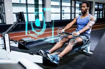 man learning resistance training on a rower
