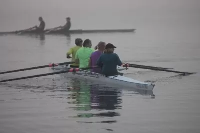 Women rowing on the water training for race day