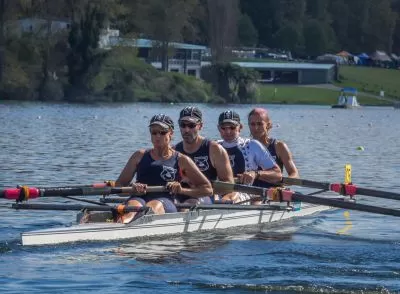 scull team rowing on river