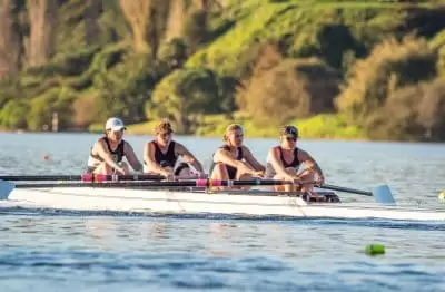 ladies rowing team training on the water
