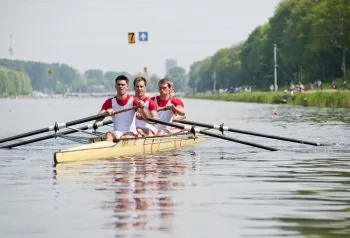 team rowing on water