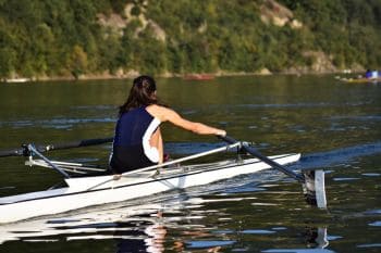 lady learning to row on water