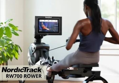 a woman doing rowing workouts using a NordicTrack RW700