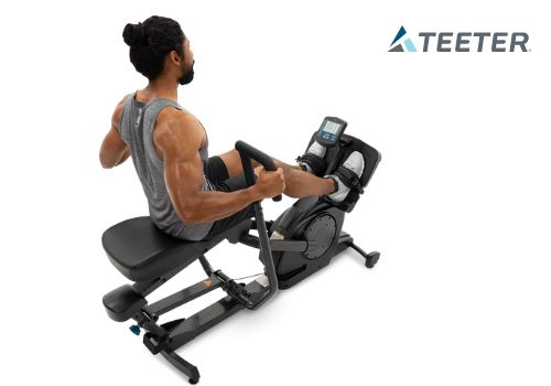 man exercising on Teeter Power10 showing monitor display 