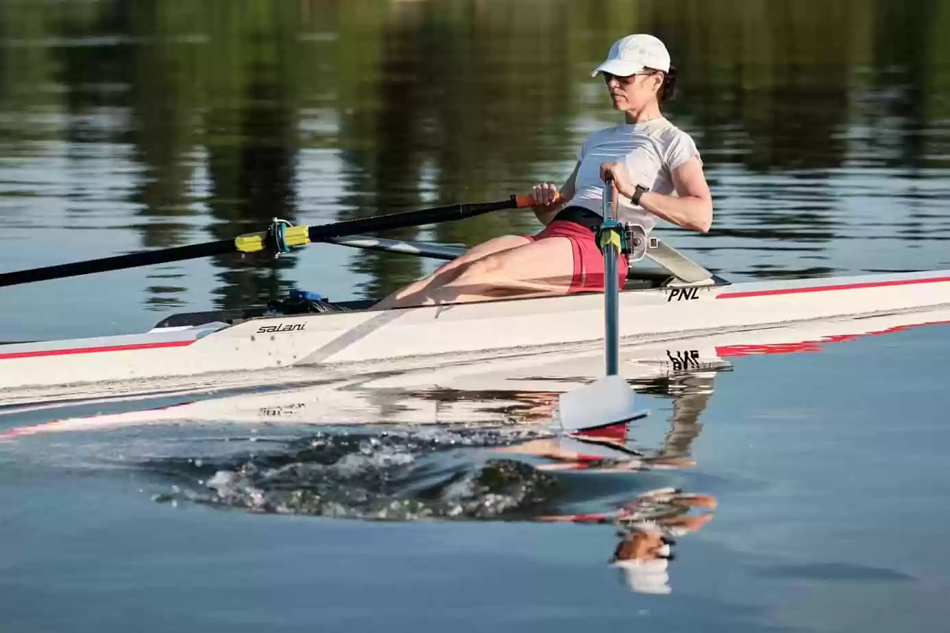a woman rowing a single scull