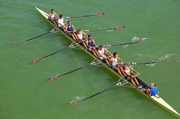 Eight rowers sweep rowing with a coxswain