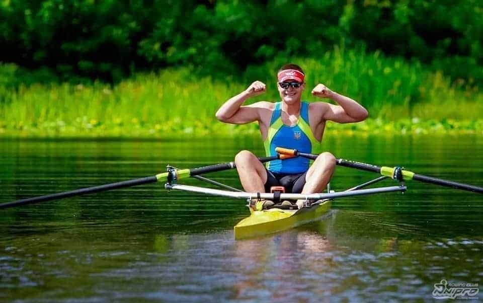 Male Single Scull Rower showing his muscles