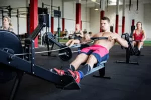 man in pink shorts rowing