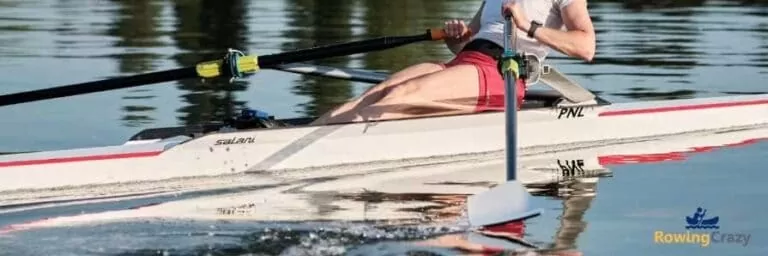 female scull rower on water