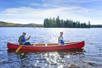 Couple canoeing on a lake