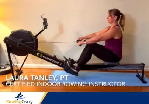 Laura Tanley on a Concept 2 rower, showing beginners the correct rowing form
