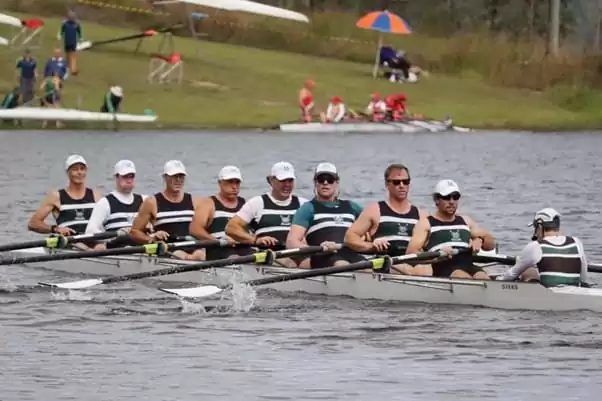 Mens Sweep team racing at a rowing regatta