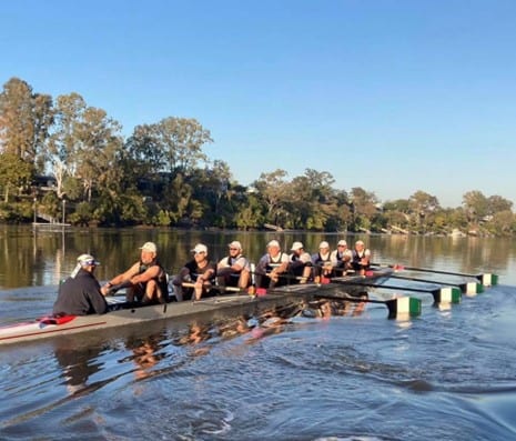 Men's 8 training at a morning workout with their coxswain