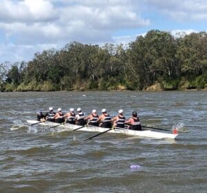 Team of rowers training for sweep race