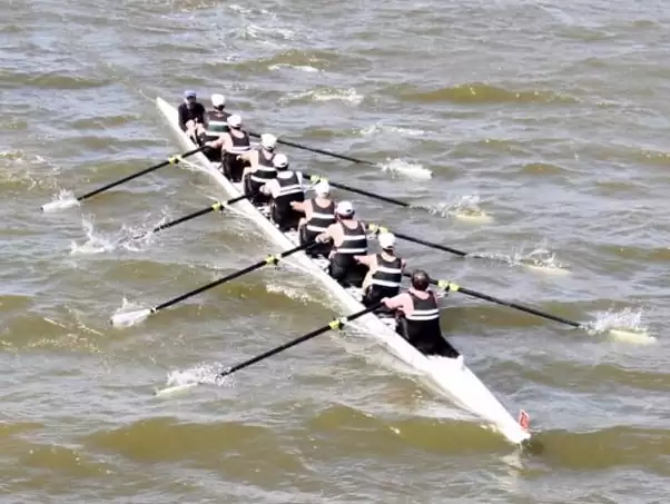 Team of rowers training for sweep race - a Coxed Eight