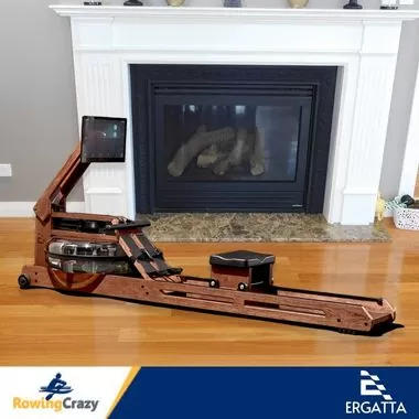 side view of an Ergatta water rower set up in a living room