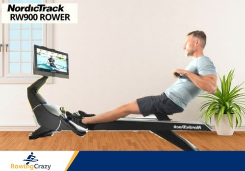 Man Performing doing rowing workouts on Rowing machine (with iFit instructor led workouts)