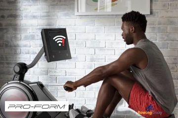 a young man sitting on a Proform rower that's not connecting to Wifi 