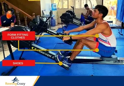 young man in proper attire for indoor rowing in a gym