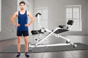 Man standing by a Hydraulic Rowing Machine