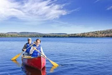 two people canoeing