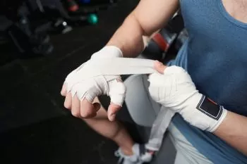 athlete wrapping or taping hands for protection